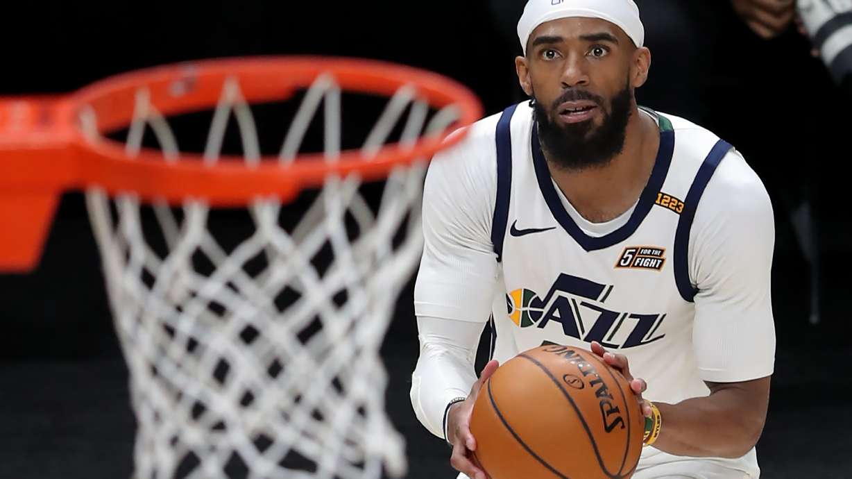 Utah Jazz guard Mike Conley (10) eyes the basket as he goes up for and hits a three point shot as the Utah Jazz and the Sacramento Kings play an NBA basketball game at Vivint Arena in Salt Lake City on Saturday, April 10, 2021.