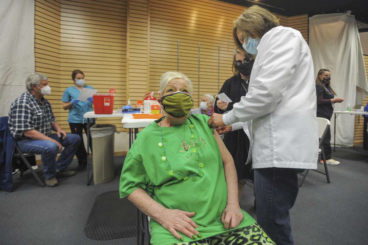 Kristy Stoos receives her COVID-19 inoculation at Grand Teton Mall in Idaho Falls, Idaho, March 17, 2021.