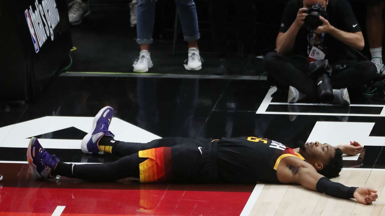 Utah Jazz guard Donovan Mitchell (45) lays on the floor after being fouled during Game 5 of their NBA playoff series against the LA Clippers in Salt Lake City on Wednesday, June 16, 2021. The Jazz lost 119-111.