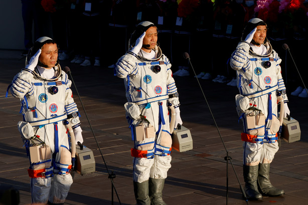 Chinese astronauts Tang Hongbo, Nie Haisheng and Liu Boming salute before the launch of the Long March-2F Y12 rocket, carrying the Shenzhou-12 spacecraft and the three astronauts, from Jiuquan Satellite Launch Center for China's first manned mission to build its space station, near Jiuquan, Gansu province, China June 17, 2021.