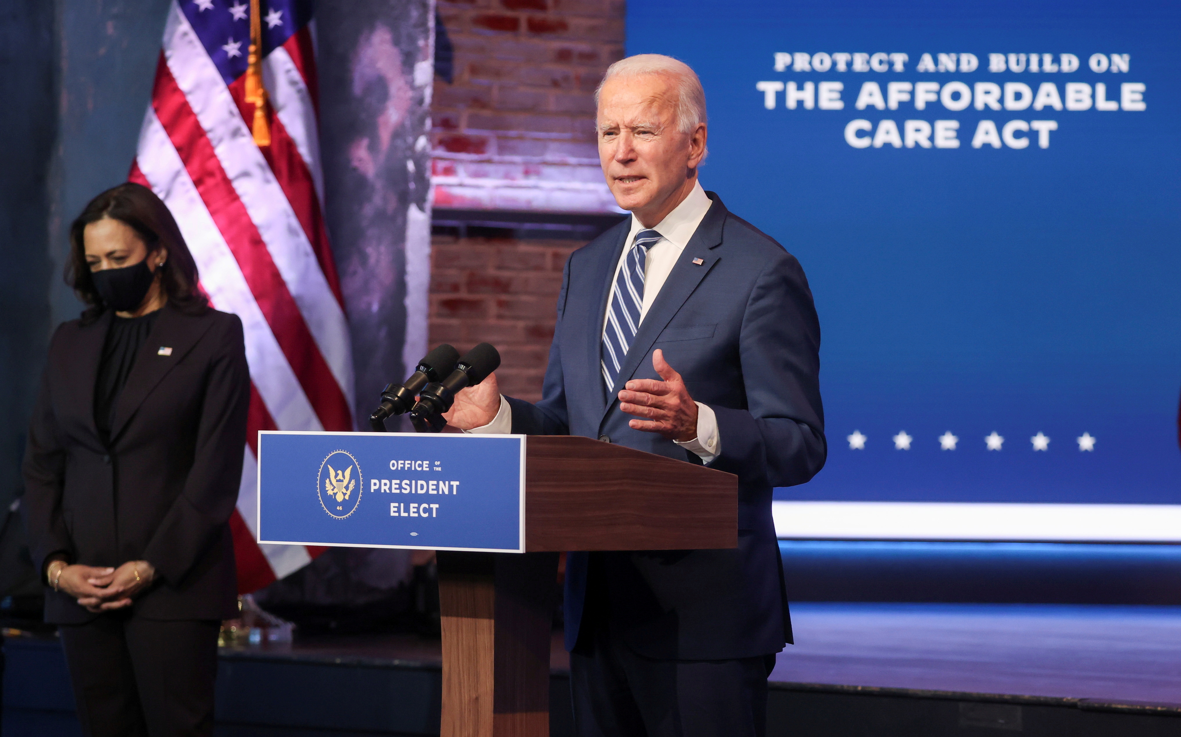 FILE: U.S. President-elect Joe Biden talks about protecting the Affordable Care Act (ACA) as he speaks to reporters with Vice President-elect Kamala Harris at this side about their "plan to expand affordable health care" during an appearance in Wilmington, Delaware, U.S., November 10, 2020. 