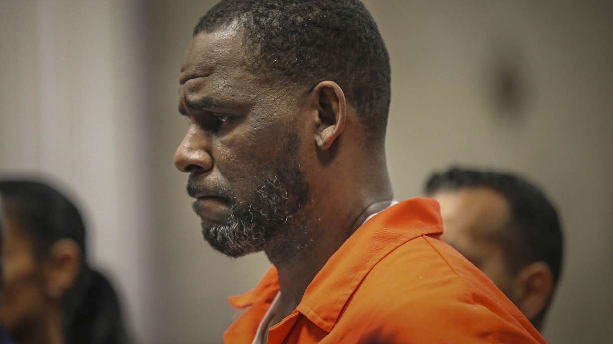 FILE - In this Sept. 17, 2019, file photo, R. Kelly appears during a hearing at the Leighton Criminal Courthouse in Chicago. U.S. District Judge Ann Donnelly signaled on Thursday, June 17, 2021, that the jailed R&B singer will likely get to keep his new defense team for his sex-trafficking trial, despite questions about his attorney's communications with one of Kelly's ex-girlfriends. (Antonio Perez/Chicago Tribune via AP, Pool, File)