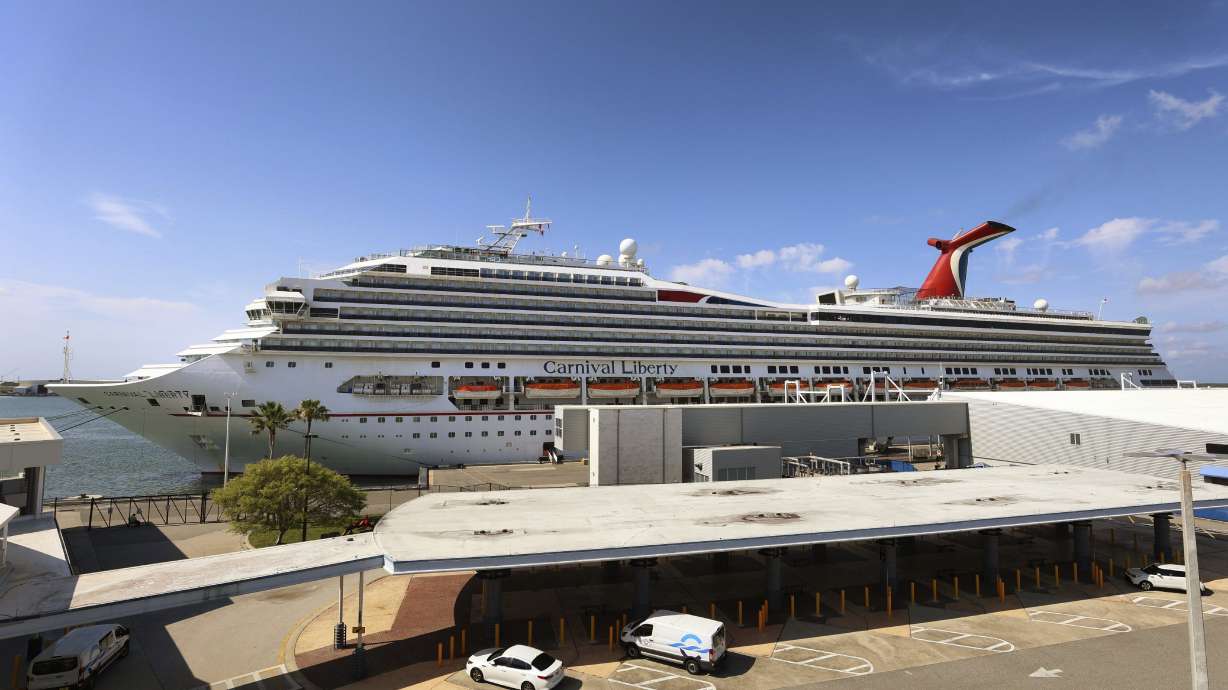 In this Wednesday, May 12, 2021, photo, the Carnival Cruise ship "Liberty" is docked at Port Canaveral, Fla., as crew members get vaccinated for COVID-19. The Miami-based company said Thursday, June 17, that a data breach in March might have exposed things like Social Security numbers and dates of birth for some customers, employees and ship crew members on Carnival Cruise Line, Holland America Line and Princess Cruises.