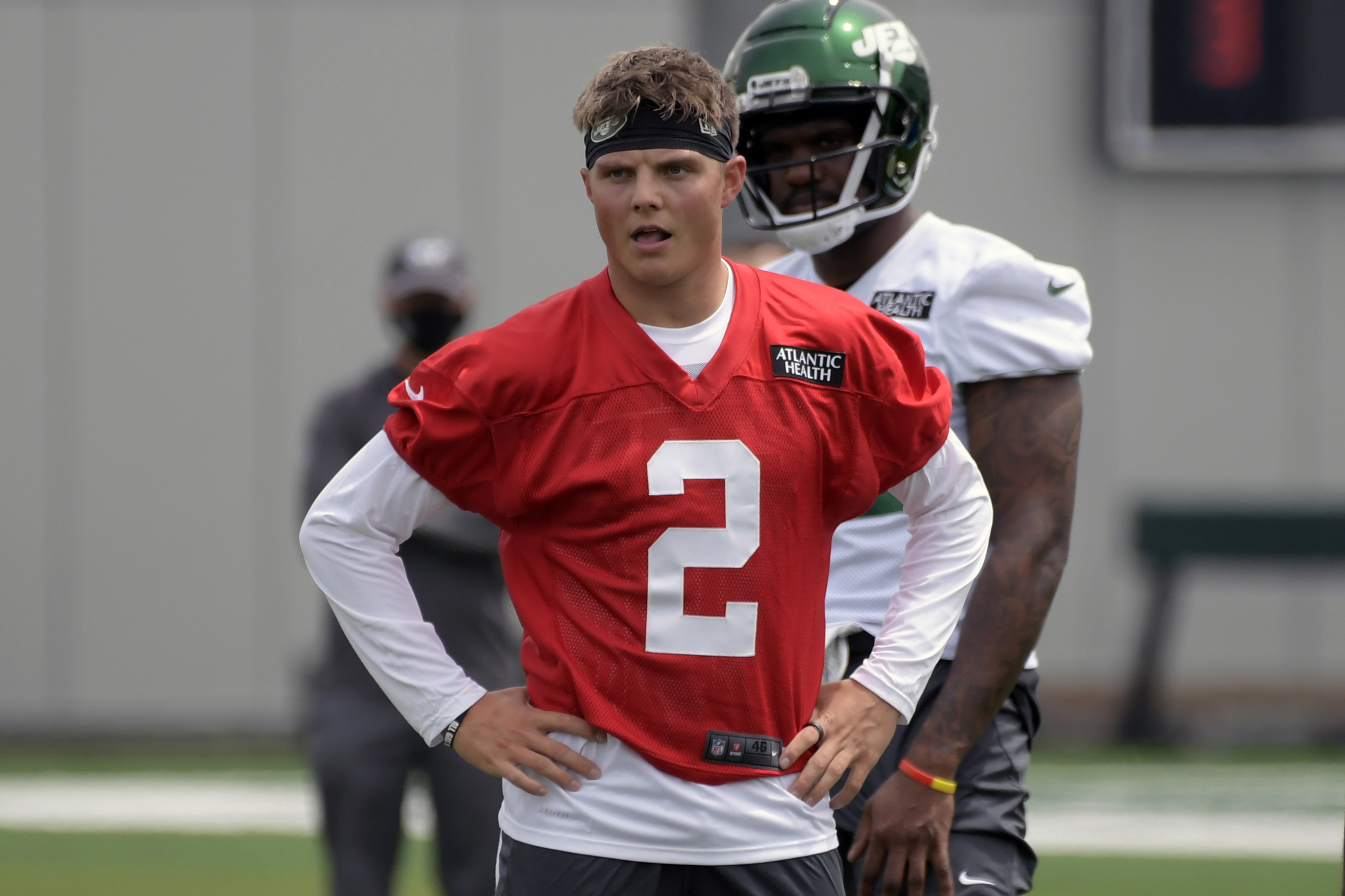 FILE - New York Jets first round draft pick Zach Wilson (2) works out during NFL football rookie camp in Florham Park, N.J., in this Friday, May 7, 2021, file photo. Wilson, the No. 2 overall pick in April, will likely become No. 35 when the Jets kick off the regular season at Carolina on Sept. 12.