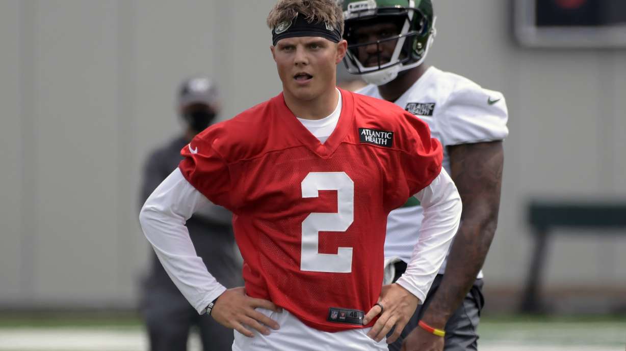 FILE - New York Jets first round draft pick Zach Wilson (2) works out during NFL football rookie camp in Florham Park, N.J., in this Friday, May 7, 2021, file photo. Wilson, the No. 2 overall pick in April, will likely become No. 35 when the Jets kick off the regular season at Carolina on Sept. 12.