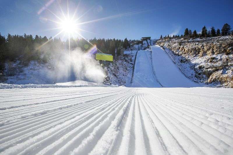 Snow machines blow man-made snow at the base of the ski
jumps at the Utah Olympic Park near Park City on Monday, Nov. 30,
2020.