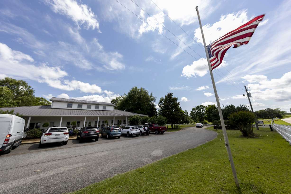 The Us Flag flies at half mast Sunday, June 20, 2021, in Camp Hill, Ala., at the Alabama Sheriff's Girls Ranch which suffered a loss of life when their van was involved in a multiple vehicle accident Saturday, resulting in eight people in the van perishing.