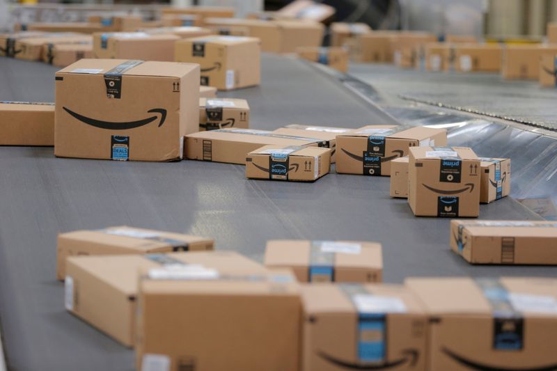 Packages emblazoned with Amazon logos travel along a conveyor belt inside of an Amazon fulfillment center in Robbinsville, New Jersey, November 27, 2017. Some big retailers are challenging Amazon during its annual Prime Day promotion Monday, and Tuesday.