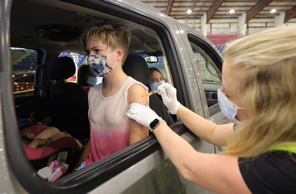 Cheyane Peterson, 12, gets a COVID-19 vaccine from Khrista Staheli at the Legacy Events Center in Farmington on May 13. The Davis County Health Department offered the Pfizer-BioNTech vaccine to anyone 12 years of age and older.