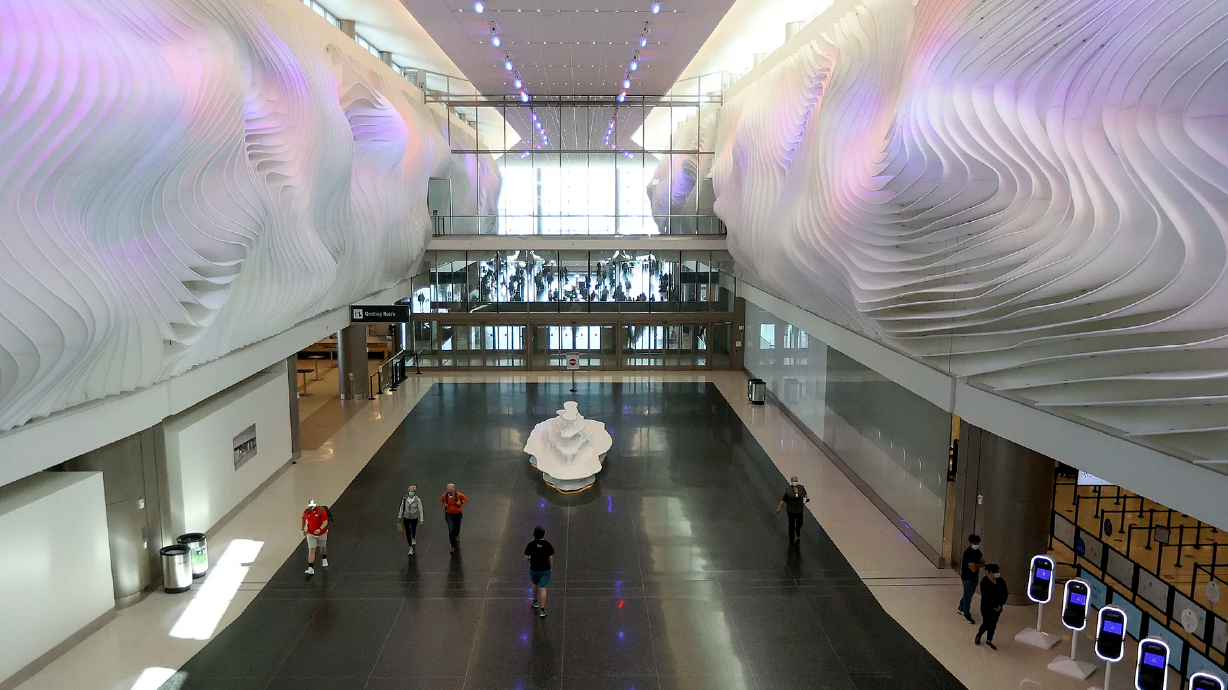 Travelers move through Salt Lake City International Airport in Salt Lake City on Tuesday, May 18, 2021. Masks are still required. However, the airport is allowing people dropping off and picking up passengers to go inside.