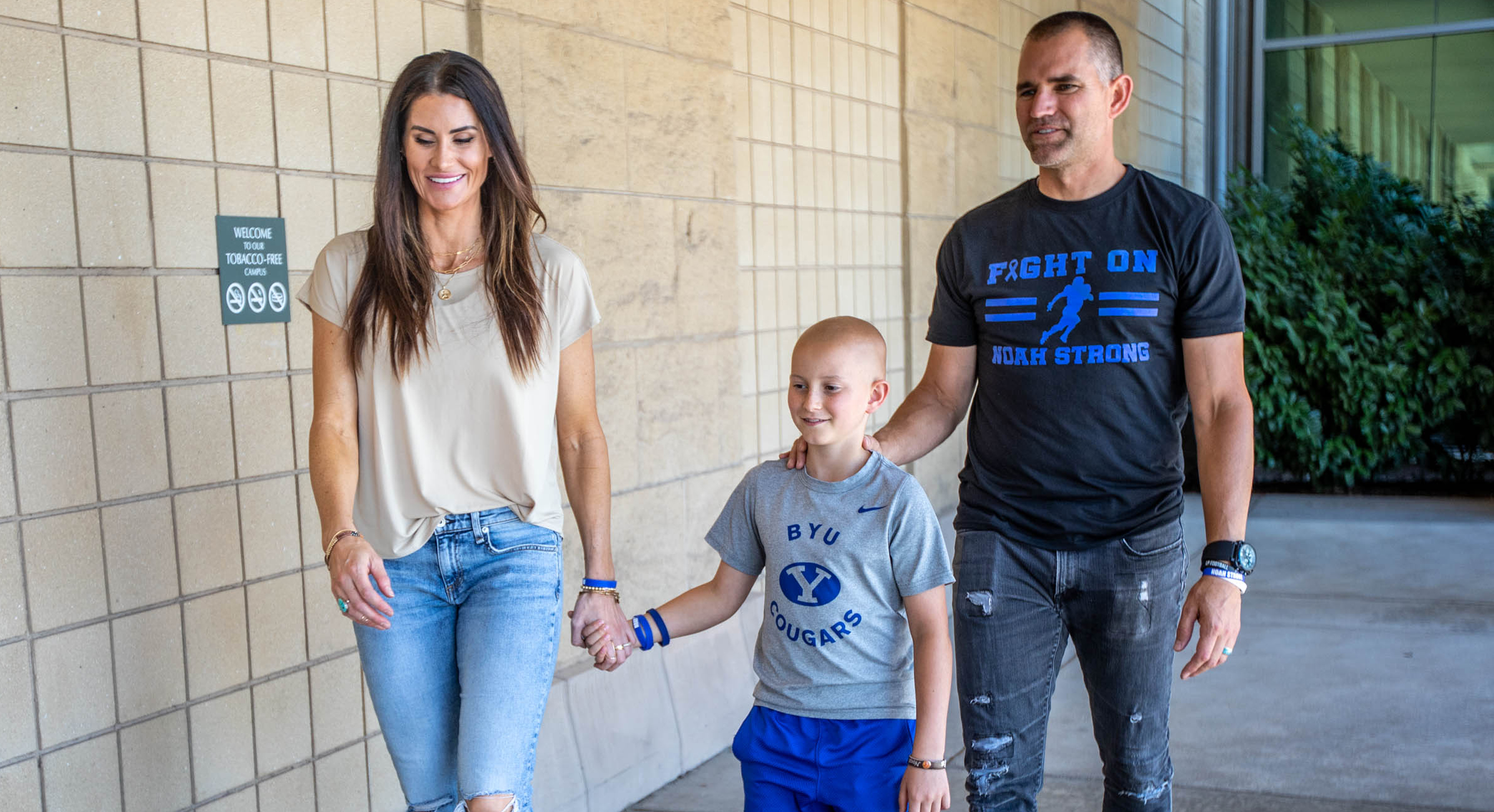 Noah Reeb walks with his parents Jacque and James Reeb at the Huntsman Cancer Institute in Salt Lake City on June 21, 2021. Due to an expansion of Huntsman Cancer Institute, proton therapy, not previously available in Utah, is available for the first time in the Mountain West.