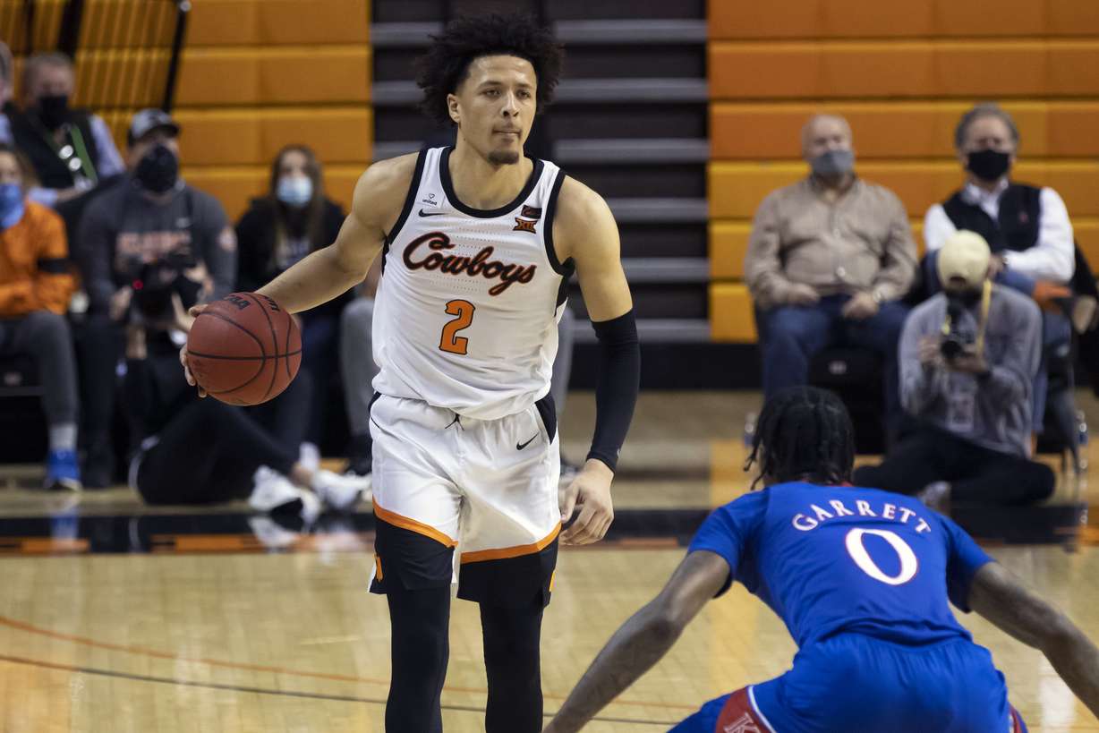 In this Tuesday, Jan. 12, 2021 file photo, Oklahoma State's Cade Cunningham (2) brings the ball up the court during the second half of the NCAA college basketball game against Kansas in Stillwater, Okla. The Detroit Pistons won the NBA draft lottery on Tuesday night, June 22, 2021 grabbing the No. 1 pick in the July 29 draft and presumably the chance to select Oklahoma State guard Cade Cunningham. If the Pistons keep the pick, it'll be the first time they select No. 1 overall since taking Bob Lanier in 1970.