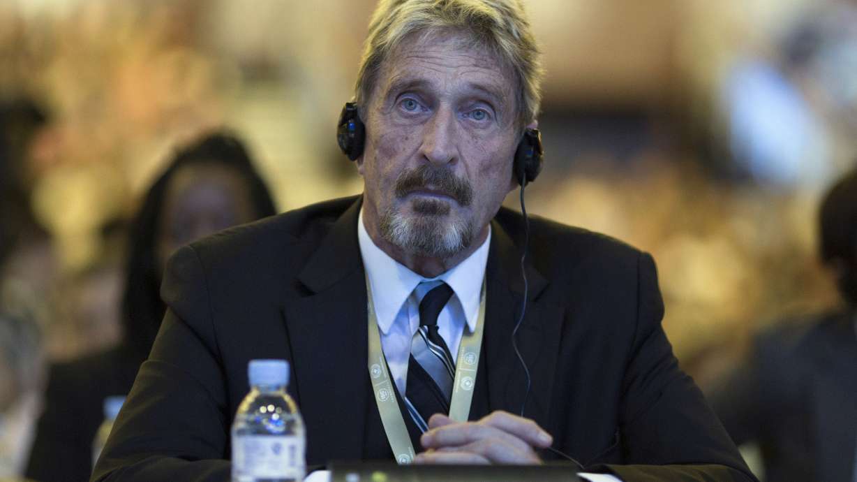FILE - In this Tuesday, Aug. 16, 2016 file photo, founder of the first commercial anti-virus program that bore his name, John McAfee listens during the 4th China Internet Security Conference (ISC) in Beijing. Spain's National Court has approved the extradition of detained antivirus software entrepreneur John McAfee to the United States, where he is wanted on tax-related criminal charges that carry a prison sentence of up to 30 years.