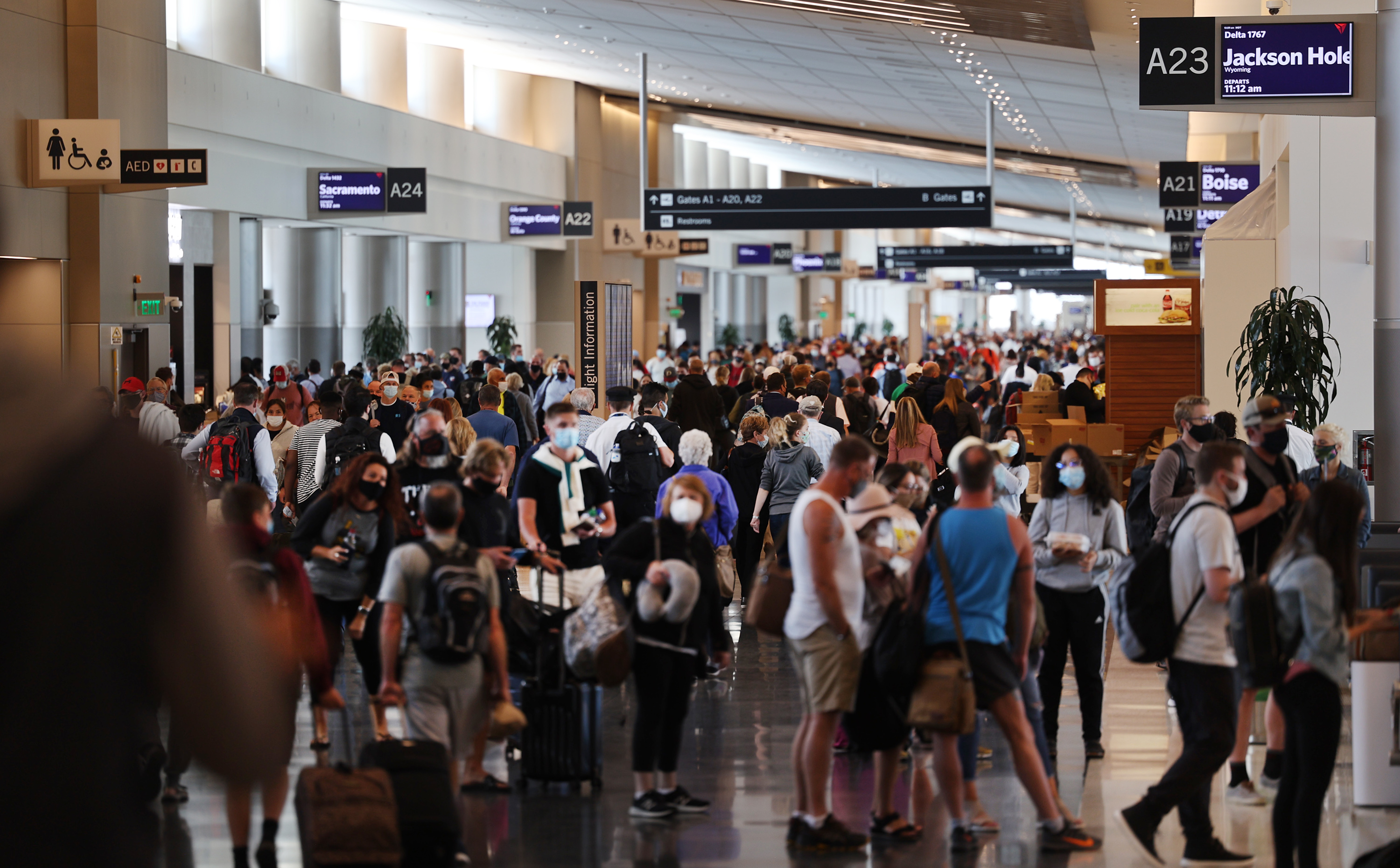 Passengers wait at their gates for flights at the Salt Lake City International Airport on May 24, 2021. Thirty-three airports across Utah are set to receive over $100 million in grants aimed to keep airports moving, the FAA announced Tuesday.