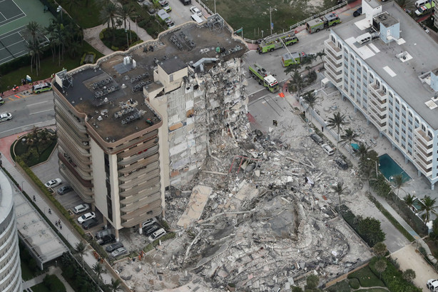 This aerial photo shows part of the 12-story oceanfront Champlain Towers South Condo that collapsed early Thursday, June 24, 2021 in Surfside, Fla.