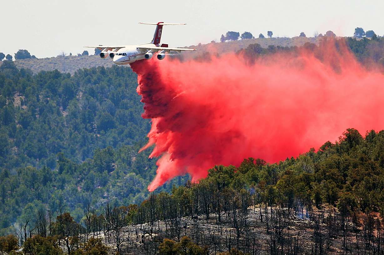 A heavy air tanker drops retardant on the Black Mountain Fire near Minersville, Beaver County, on Friday, June 29, 2018. A retardant drop such as this can cost tens of thousands of dollars a day.