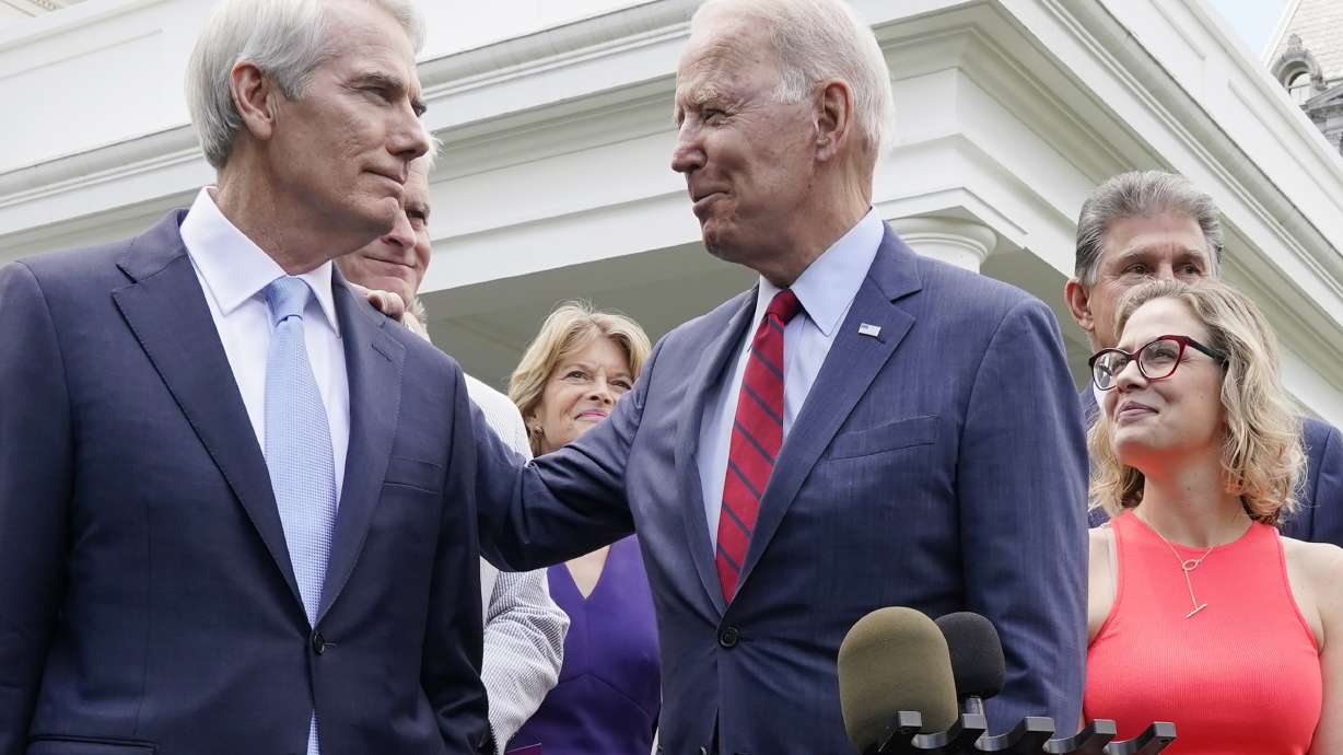 President Joe Biden speaks with Sen. Rob Portman, R-Ohio, and a bipartisan group of senators, Thursday, June 24, 2021, outside the White House in Washington. Republican senators Friday were frantically considering options as the future of the sweeping compromise appeared in doubt.