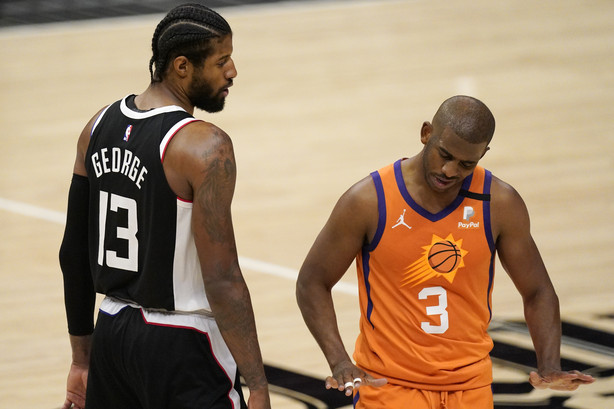 Los Angeles Clippers guard Paul George, left, tires to talk to Phoenix Suns guard Chris Paul during the second half in Game 3 of the NBA basketball Western Conference Finals Thursday, June 24, 2021, in Los Angeles.