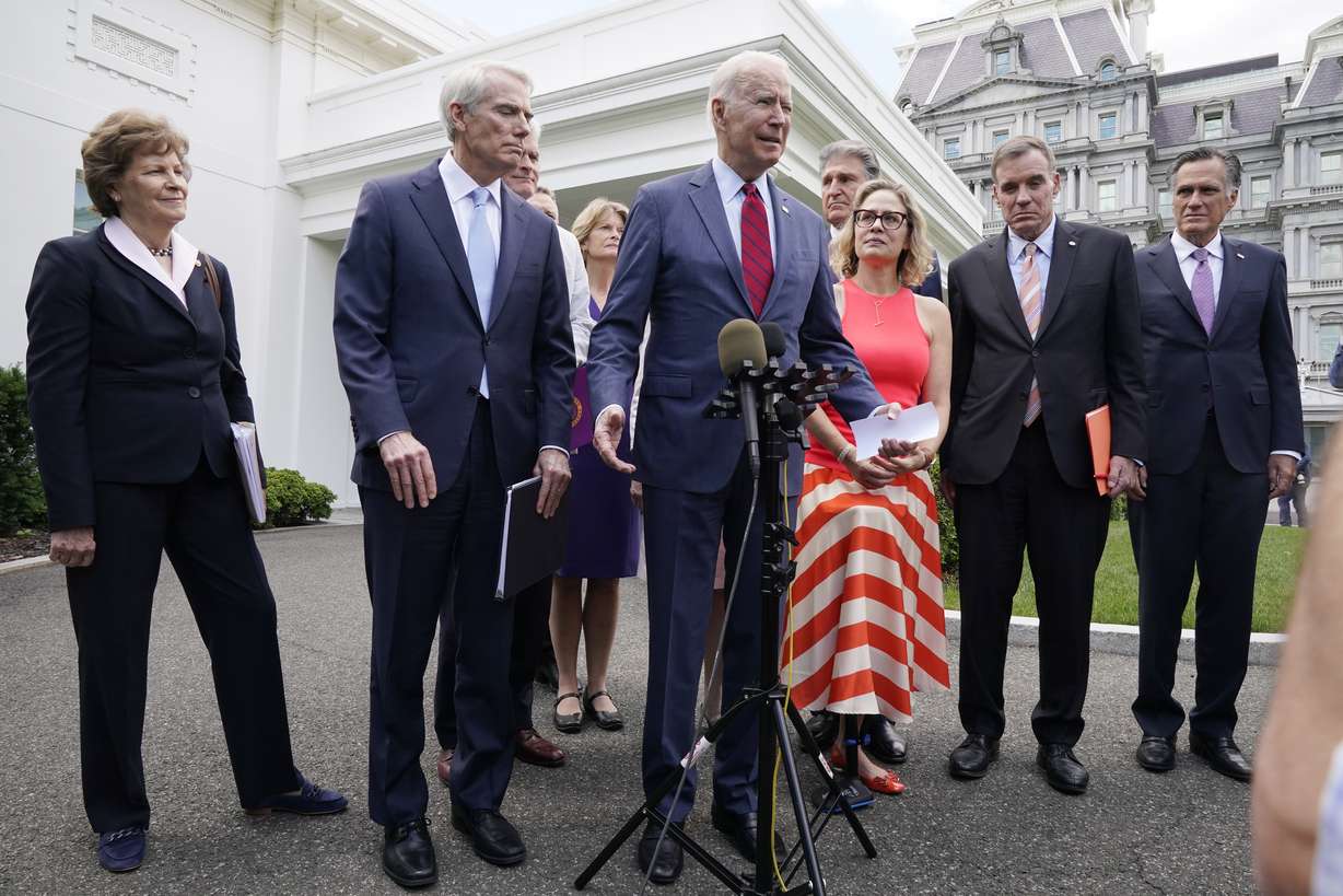 President Joe Biden, with a bipartisan group of senators that includes Utah Sen. Mitt Romney, speaks Thursday June 24, 2021, outside the White House in Washington.