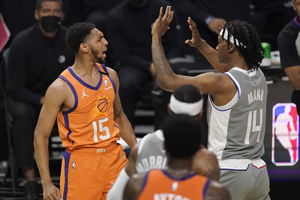 Phoenix Suns guard Cameron Payne, left, and Los Angeles Clippers guard Terance Mann scuffle during the first half in Game 4 of the NBA basketball Western Conference Finals Saturday, June 26, 2021, in Los Angeles.