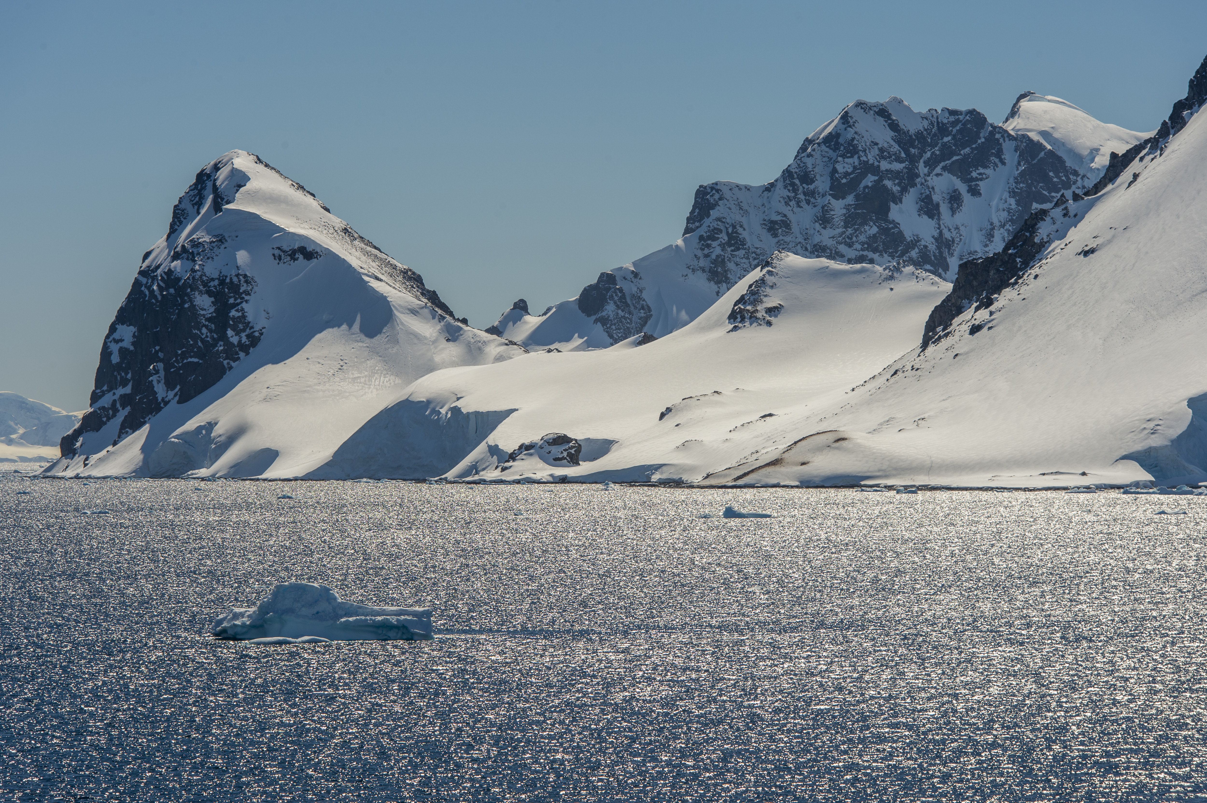 View of backlit mountains in the Gerlache Strait at Cuverville Island in the Antarctic Peninsula region. (Photo by Wolfgang Kaehler/LightRocket via Getty Images)