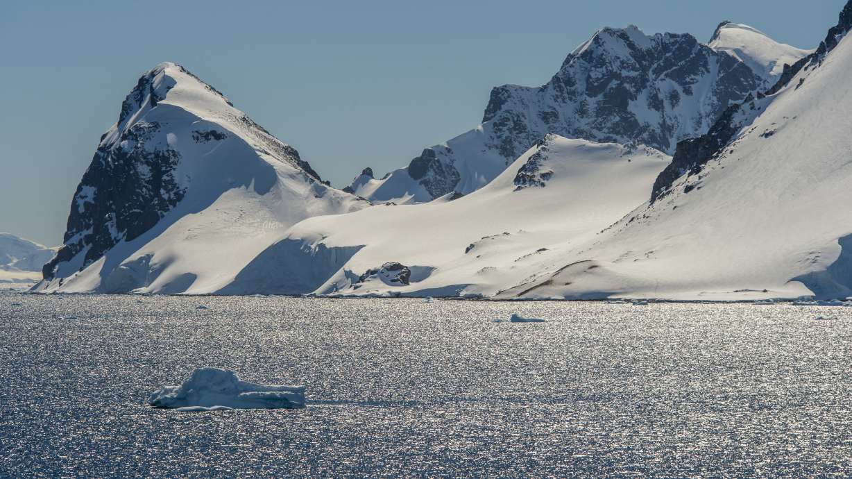 View of backlit mountains in the Gerlache Strait at Cuverville Island in the Antarctic Peninsula region. (Photo by Wolfgang Kaehler/LightRocket via Getty Images)