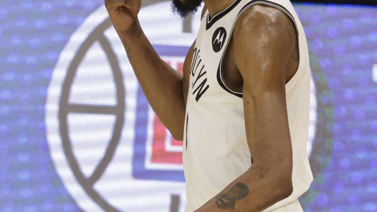 Brooklyn Nets' Kevin Durant points to his head during the second half of Game 6 of a second-round NBA basketball playoff series against the Milwaukee Bucks, Thursday, June 17, 2021, in Milwaukee.