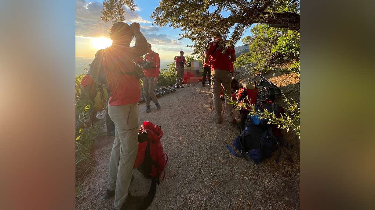Members of the Salt Lake County Search and Rescue team help an injured hiker get down from Ferguson Canyon on Saturday, June 26, 2021.