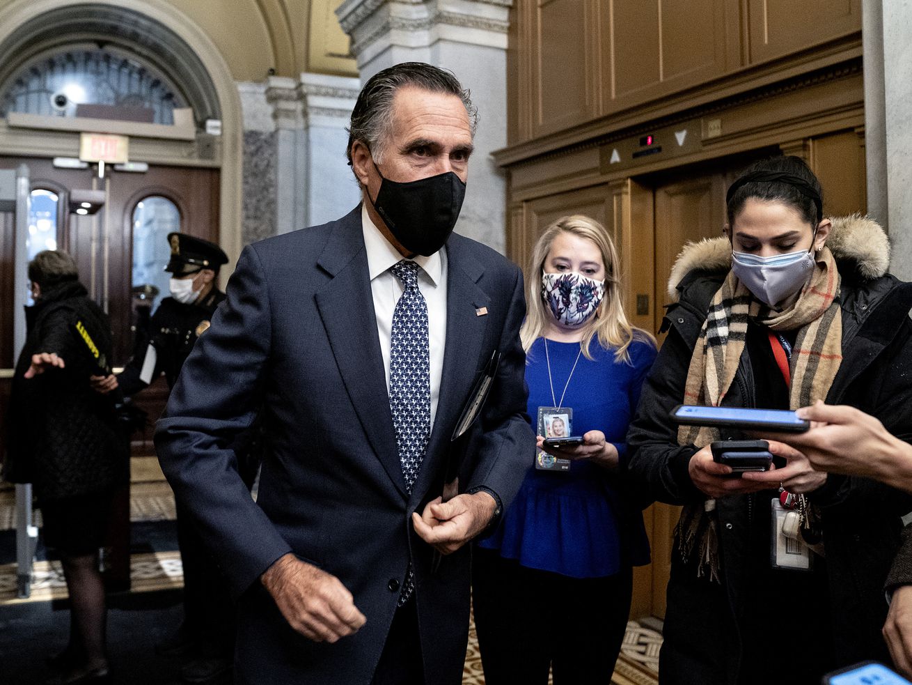 Sen. Mitt Romney, R-Utah, speaks to reporters as he
arrives on the fifth day of the second impeachment trial of former
President Donald Trump, Saturday, Feb. 13, 2021, at the Capitol in
Washington.