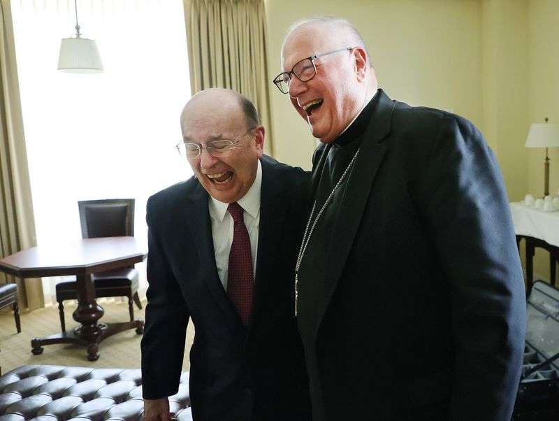 Elder Quentin L. Cook, a member of the Quorum of the
Twelve Apostles of The Church of Jesus Christ of Latter-day Saints,
left, and Cardinal Timothy Dolan, archbishop of New York, laugh
during an interview during the Notre Dame Religious Liberty Summit
at the University of Notre Dame in South Bend, Ind., on Monday,
June 28, 2021.