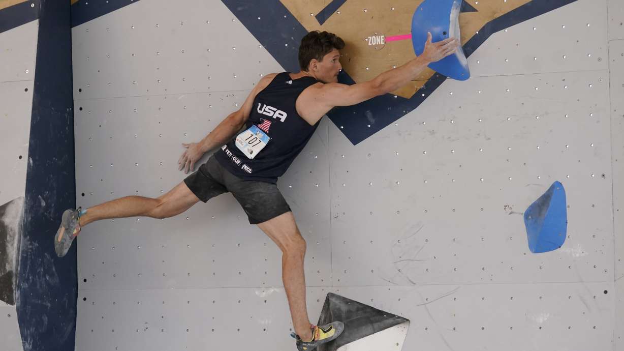 Nathaniel Coleman climbs during the men's boulder qualification at the climbing World Cup in Salt Lake City, in this Friday, May 21, 2021, file photo. Climbing is an Olympic sport for the first time, and the spotlight will introduce a massive audience to what can be a lonely pursuit.