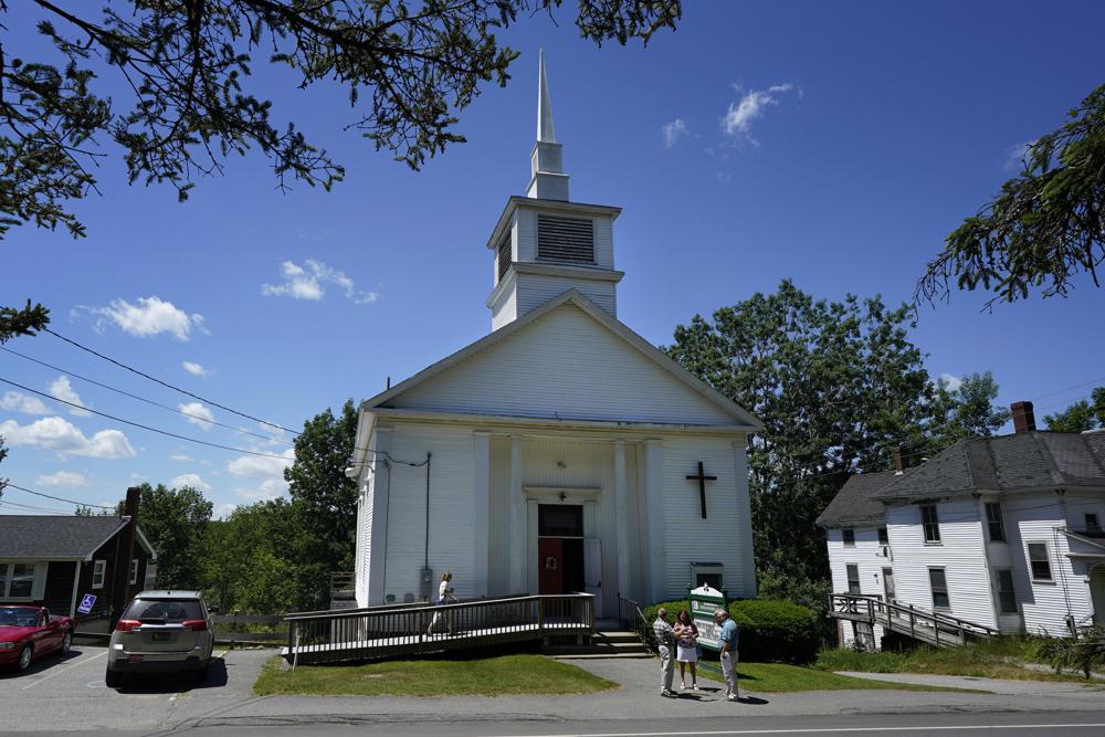 Members of 164-year-old Waldoboro United Methodist Church chat following a service, Sunday, June 20, 2021, in Waldoboro, Maine. The drop in attendance at the church, in part due to COVID-19, forced its closure. The last sermon was on June 27.