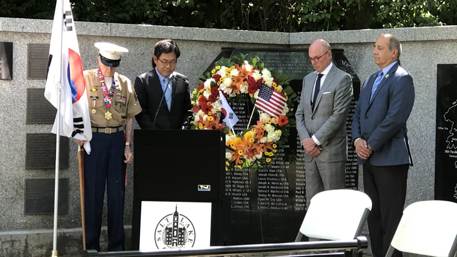 Marine veteran John Cole, left, and Sang Soo Yoon, Consul General of South Korea, second from left, as the top South Korean diplomat visited Salt Lake City to commemorate the Korean War and thank the Utah veterans who fought to free his country seven decades ago.  