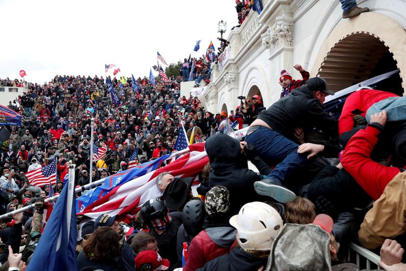 Pro-Trump protesters storm into the U.S. Capitol during clashes with police, during a rally to contest the certification of the 2020 U.S. presidential election results by the U.S. Congress, in Washington, D.C., on Jan. 6, 2021.