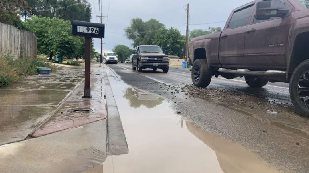 Rocks and mud left along 3600 West after Midas Creek overflowed on June 24, 2021. Forecasters say heavy storms mean the potential for more flash flooding, especially around the national parks.