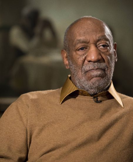 In this photo taken Nov. 6, 2014, entertainer Bill Cosby pauses during an interview about an exhibit at the Smithsonian's National Museum of African Art in Washington. On Wednesday, Pennsylvania’s highest court overturned Bill Cosby’s sex assault conviction after finding an agreement with a previous prosecutor prevented him from being charged in the case.