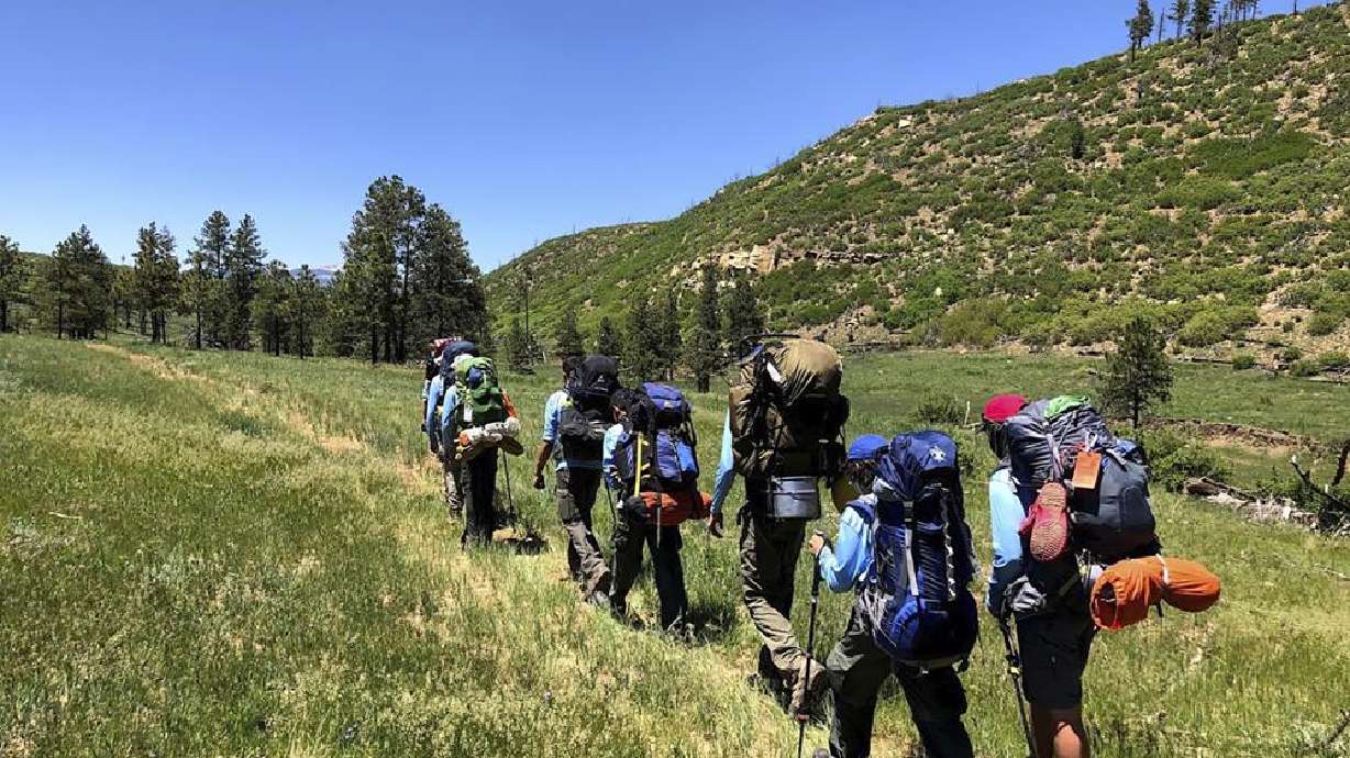 In this June 10, 2021, photo provided by Barry Bedlan, members of Troop 298 of Frisco, Texas, are among the first to embark a 12-day trek across the Philmont Scout Ranch, outside Cimarron, N.M. Boy Scout and Girl Scouts’ leadership say they have seen an unprecedented one-year drop in membership.
