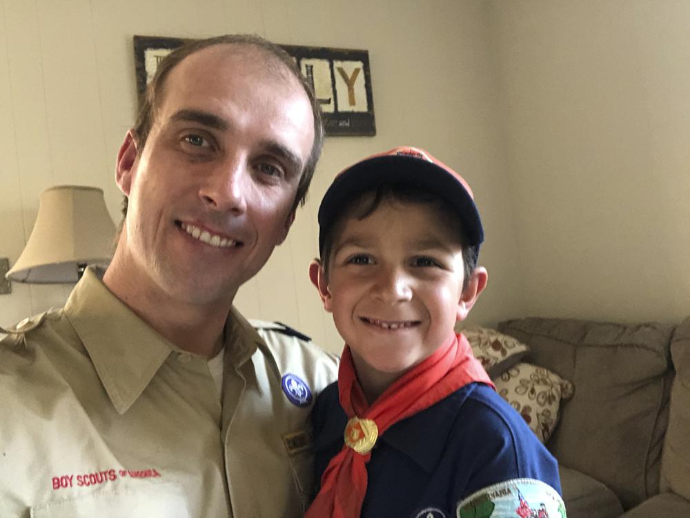 This 2020 photo provided by Jay Yaros shows him and his son, Joey, in Lawrence, N.J. Yaros says Joey didn’t thrive with virtual school classes during the pandemic, and the family didn’t pressure him to also participate in virtual Cub Scout activities after his den stopped in-person meetings. “If there are den meetings in the fall, we’ll see if he gets back in the swing of it,” Yaros said, “There are a lot of interesting things for kids to do these days, and scouting doesn’t seem to be keeping up.”