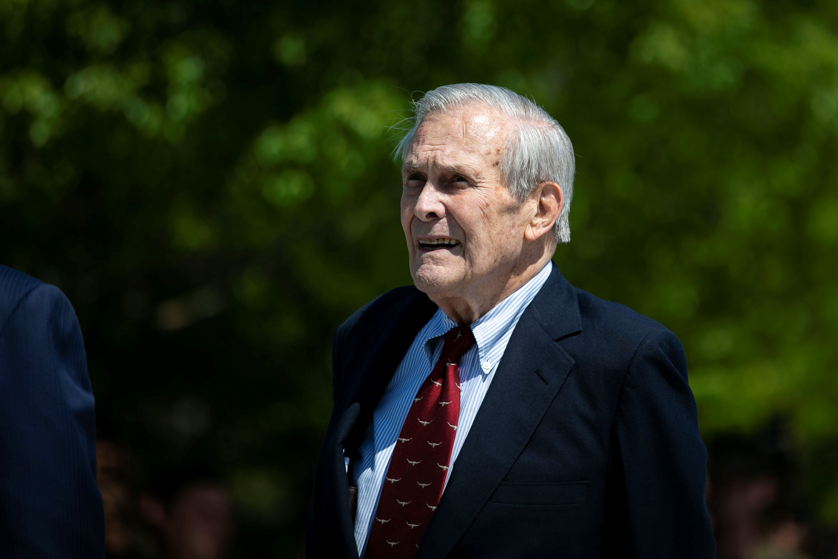 Former U.S. Defense Secretary Donald Rumsfeld looks on after former U.S. President George W. Bush placed a wreath during the 18th anniversary of the September 11 attacks at the Pentagon in Arlington, Virginia, Sept. 11, 2019. 