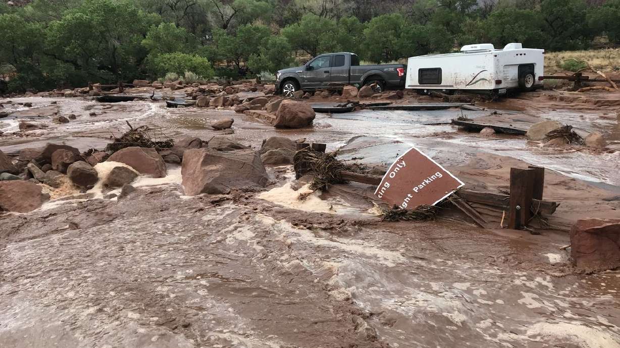 Floodwaters overtook roads and parking areas inside Zion National Park after thundershowers dumped much-needed rain in southern Utah Tuesday.