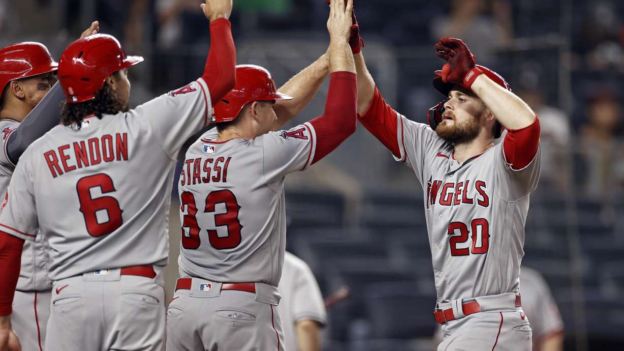 Los Angeles Angels' Jared Walsh (20) celebrates his grand slam with teammates during the ninth inning of a baseball game against the New York Yankees early Thursday, July 1, 2021, in New York. The Angels selected former Fremont pitcher Ky Bush in the second round of Monday's MLB draft.