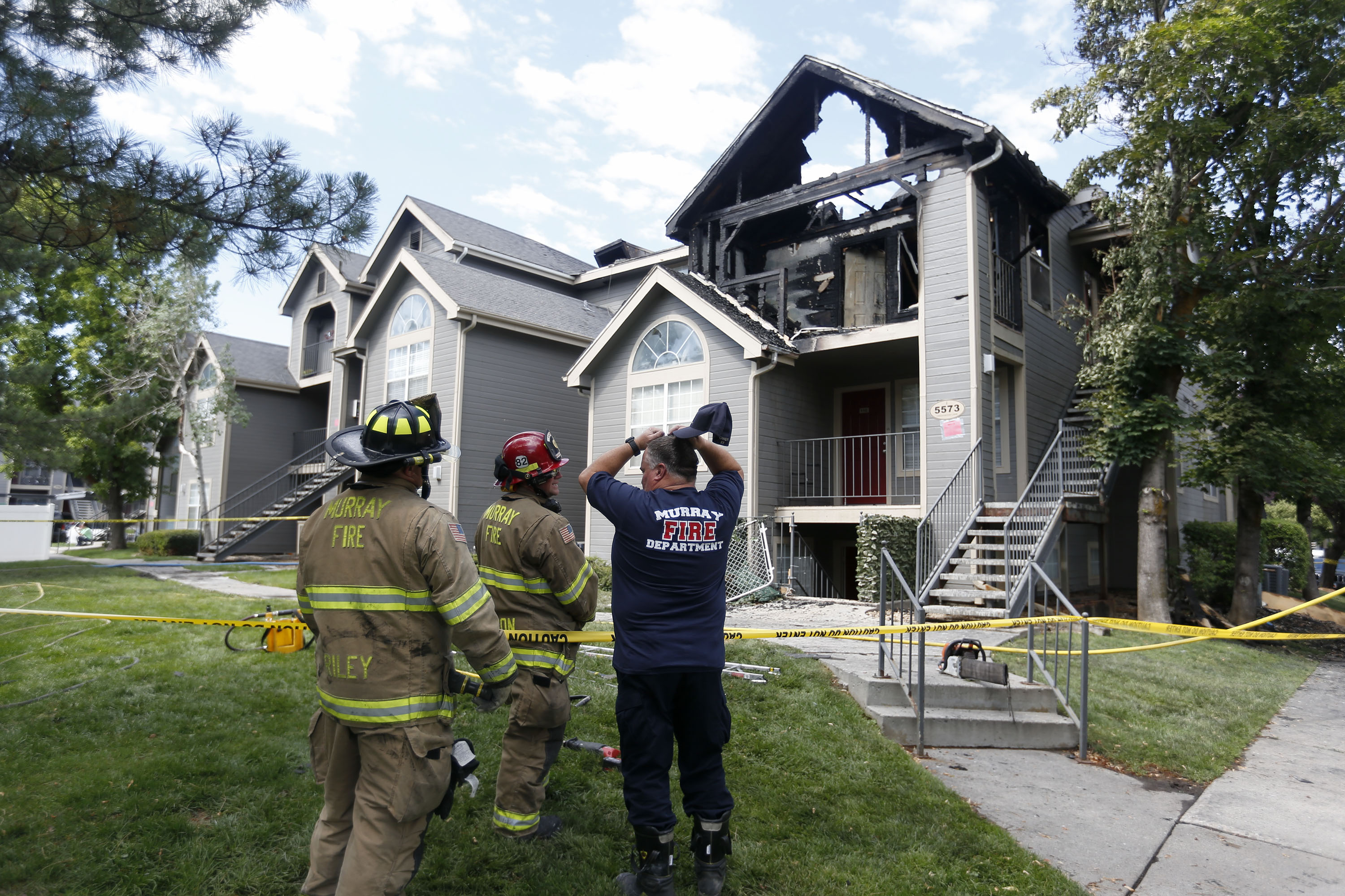 Murray firefighters assess fire damage at the Stillwater Apartments near 5500 South and Vine Street in Murray on Thursday, July 1, 2021. Dozens of people were forced from their homes when fire broke out at the apartment complex early Thursday morning.