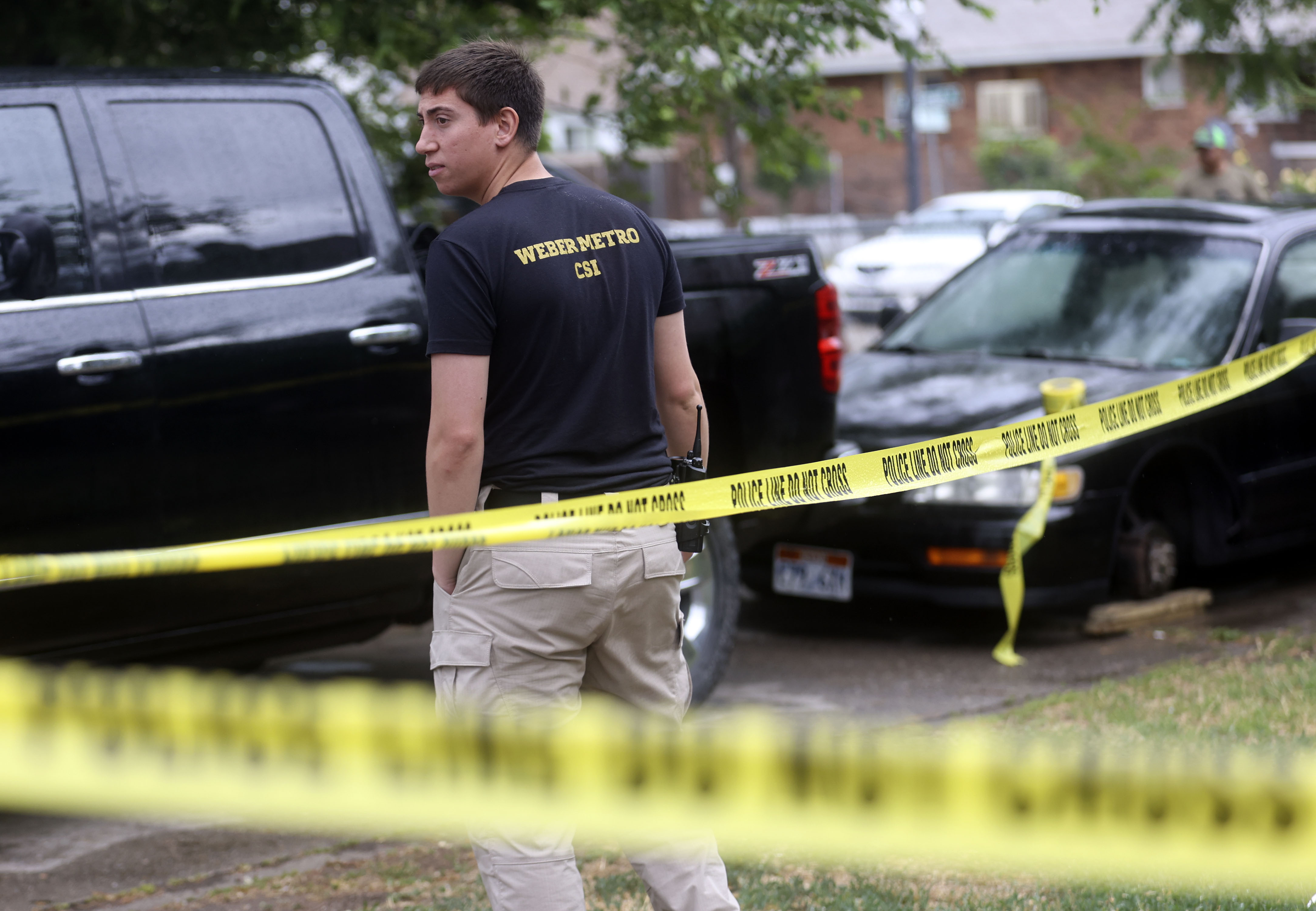 Crime scene investigators work at the scene of a shooting on Monroe Boulevard in Ogden on Thursday, June 24, 2021. Utah's homicide rate during the first six months of this year is on track to match the record number of homicides that occurred in 2020.
