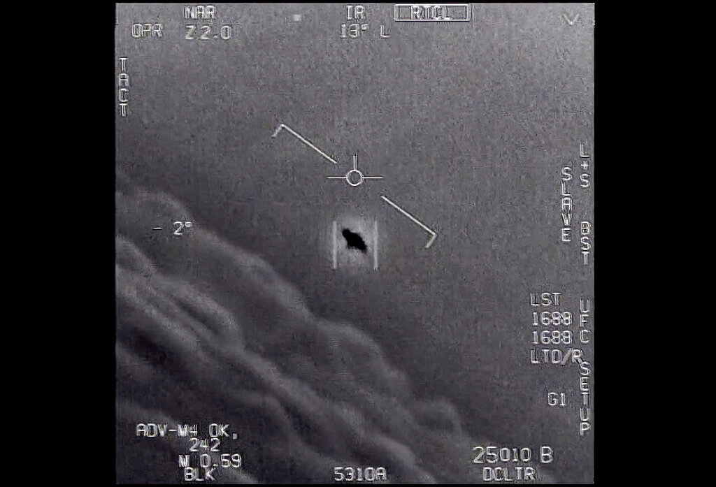 The image from video provided by the Department of Defense labelled Gimbal, from 2015, an unexplained object is seen at center as it is tracked as it soars high along the clouds, traveling against the wind. "There's a whole fleet of them," one naval aviator tells another, though only one indistinct object is shown. "It's rotating." The U.S. government has been taking a hard look at unidentified flying objects, under orders from Congress, and a report summarizing what officials know was released in June 2021.