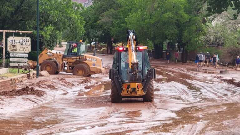 Crews work to clear Zion Park Boulevard after flash floods swept through Zion National Park and Springdale, Utah, June 29, 2021.