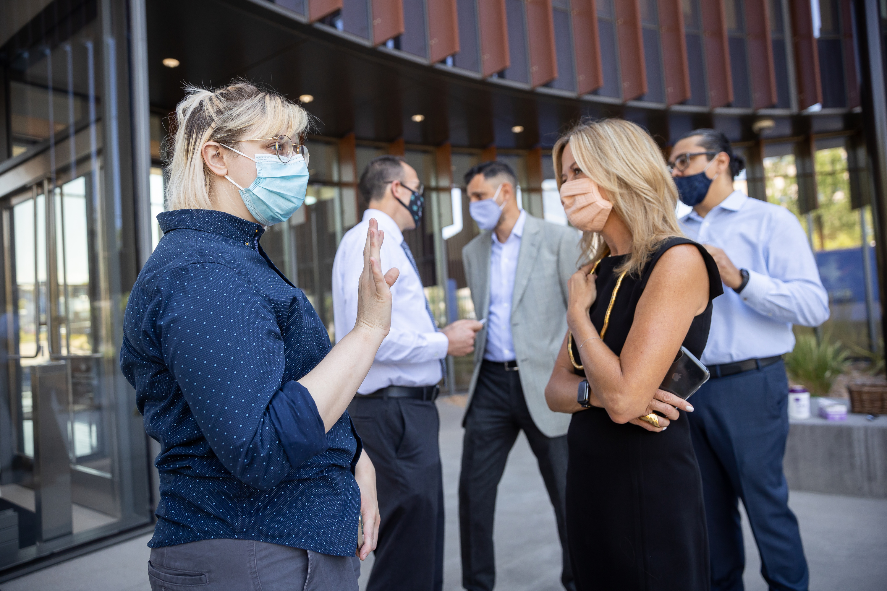 Ray Bailey, youth suicide prevention program manager at the Utah Department of Human Services, talks with Mikelle Moore, senior vice president and chief community health officer at Intermountain Healthcare, after a press conference at the Intermountain Healthcare Transformation Center in Murray on Friday, July 2, 2021.