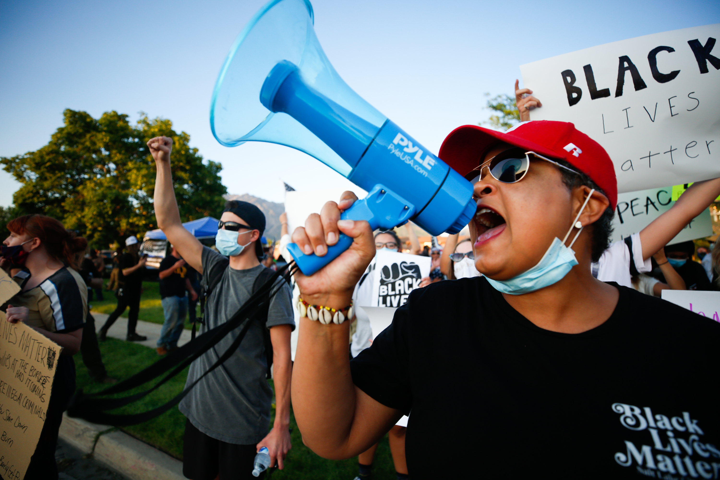 Lex Scott, founder of the Utah chapter of Black Lives Matter, chants as protesters and counterprotesters clash outside of the Cottonwood Heights Police Department in Cottonwood Heights on Monday, Aug. 3, 2020.
