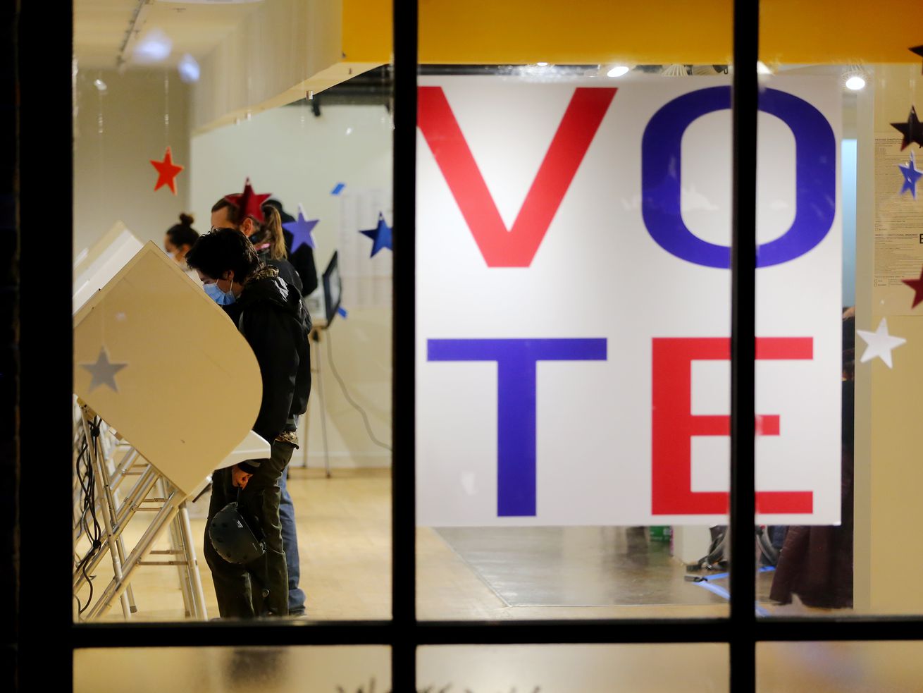 Voters cast their ballots at Trolley Square in Salt Lake City last November. While Utah’s all-Republican congressional delegation roundly condemned a sweeping voting rights bill, more than half of voters in the state favor national guidelines for
voting in elections across the country.