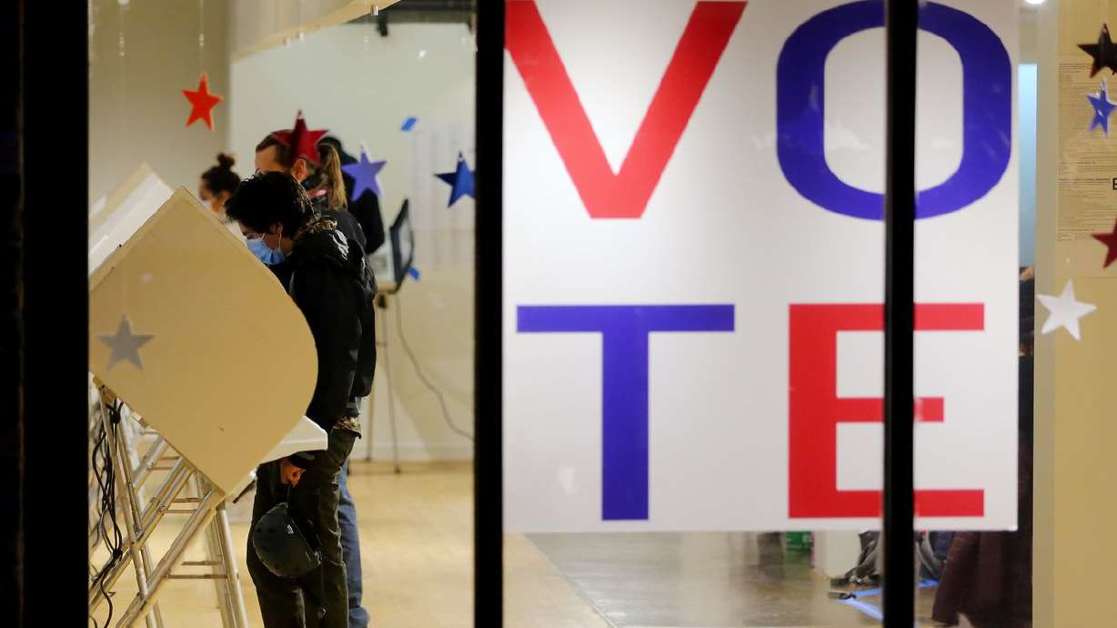 Voters cast their ballots at Trolley Square in Salt Lake City last November. While Utah’s all-Republican congressional delegation roundly condemned a sweeping voting rights bill, more than half of voters in the state favor national guidelines for
voting in elections across the country.