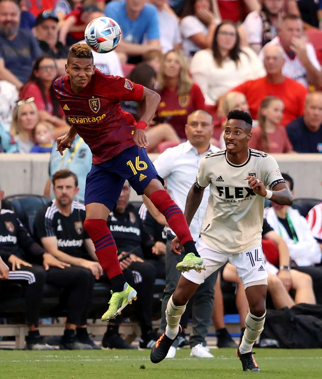 Real Salt Lake midfielder Maikel Chang (16) heads the ball away from Los Angeles FC midfielder Mark-Anthony Kaye (14) as RSL and LAFC play at Rio Tinto Stadium in Sandy on Saturday, July 3, 2021.